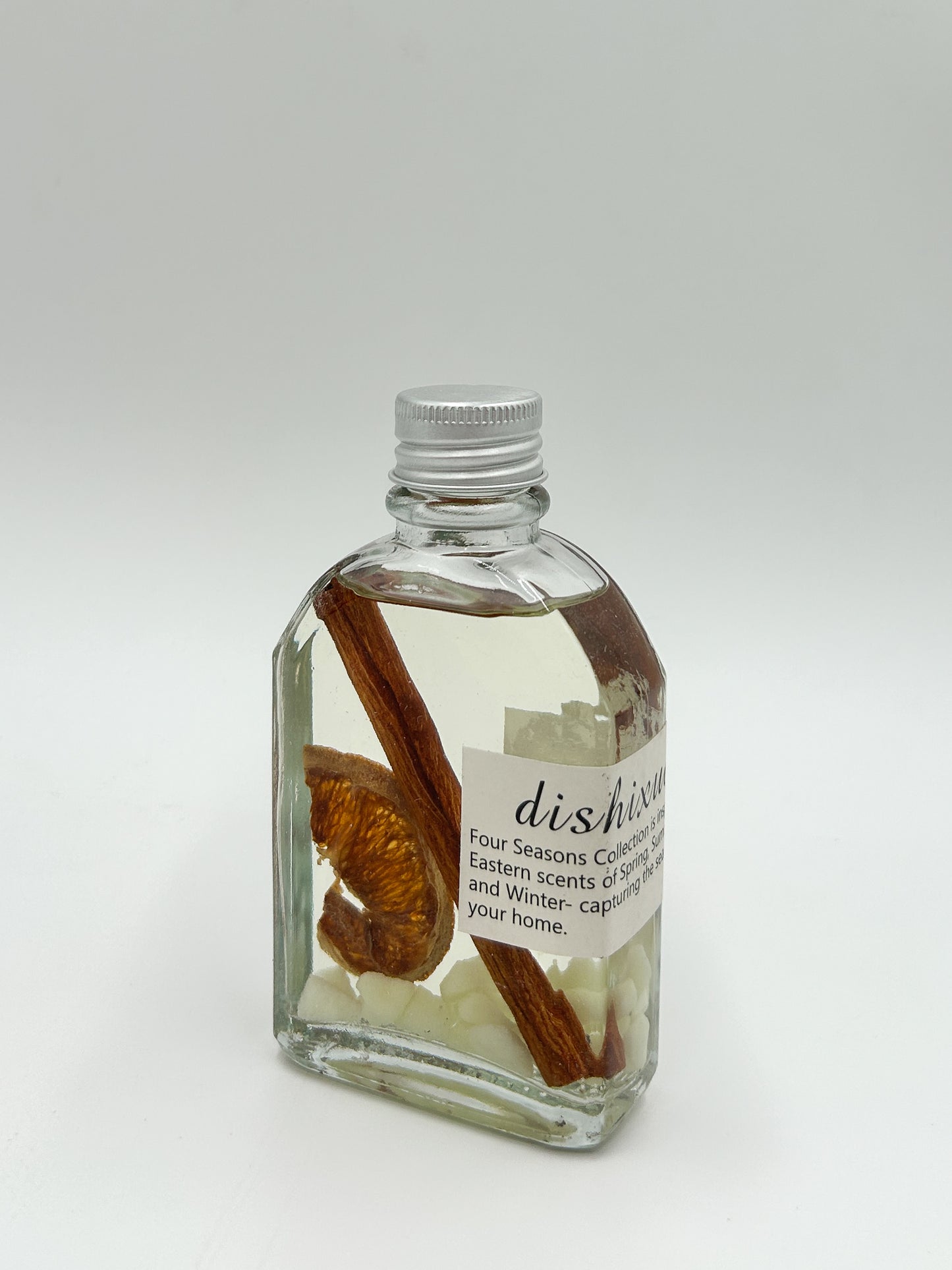 Orange and Cinnamon scented reed diffuser with dried orange and cinnamon