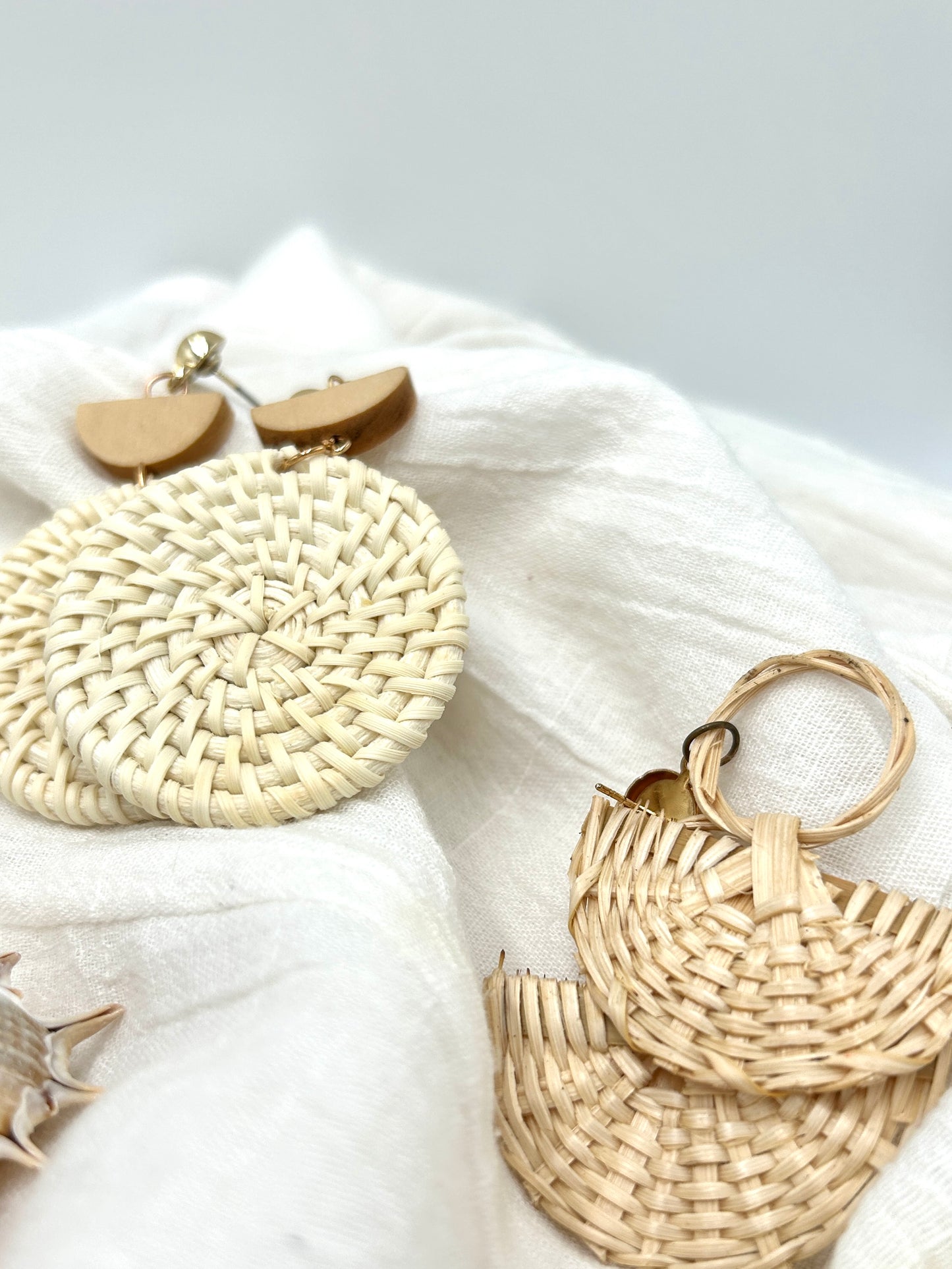 Round rattan woven drop earring with wooden and gold accents