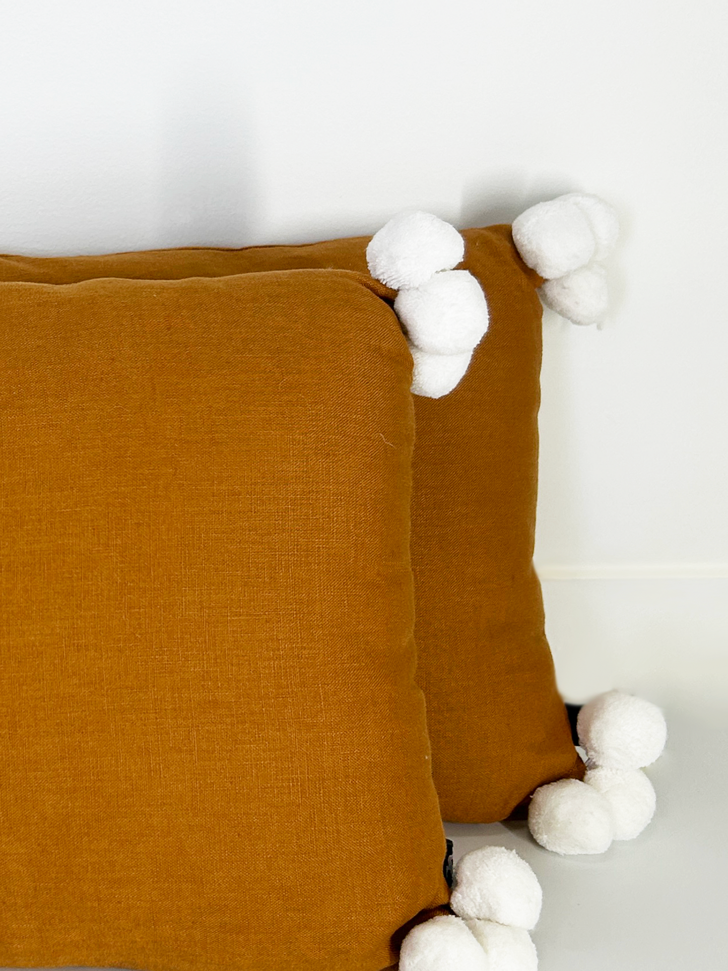 Rust and White Rectangle Throw Cushion with Pom Poms