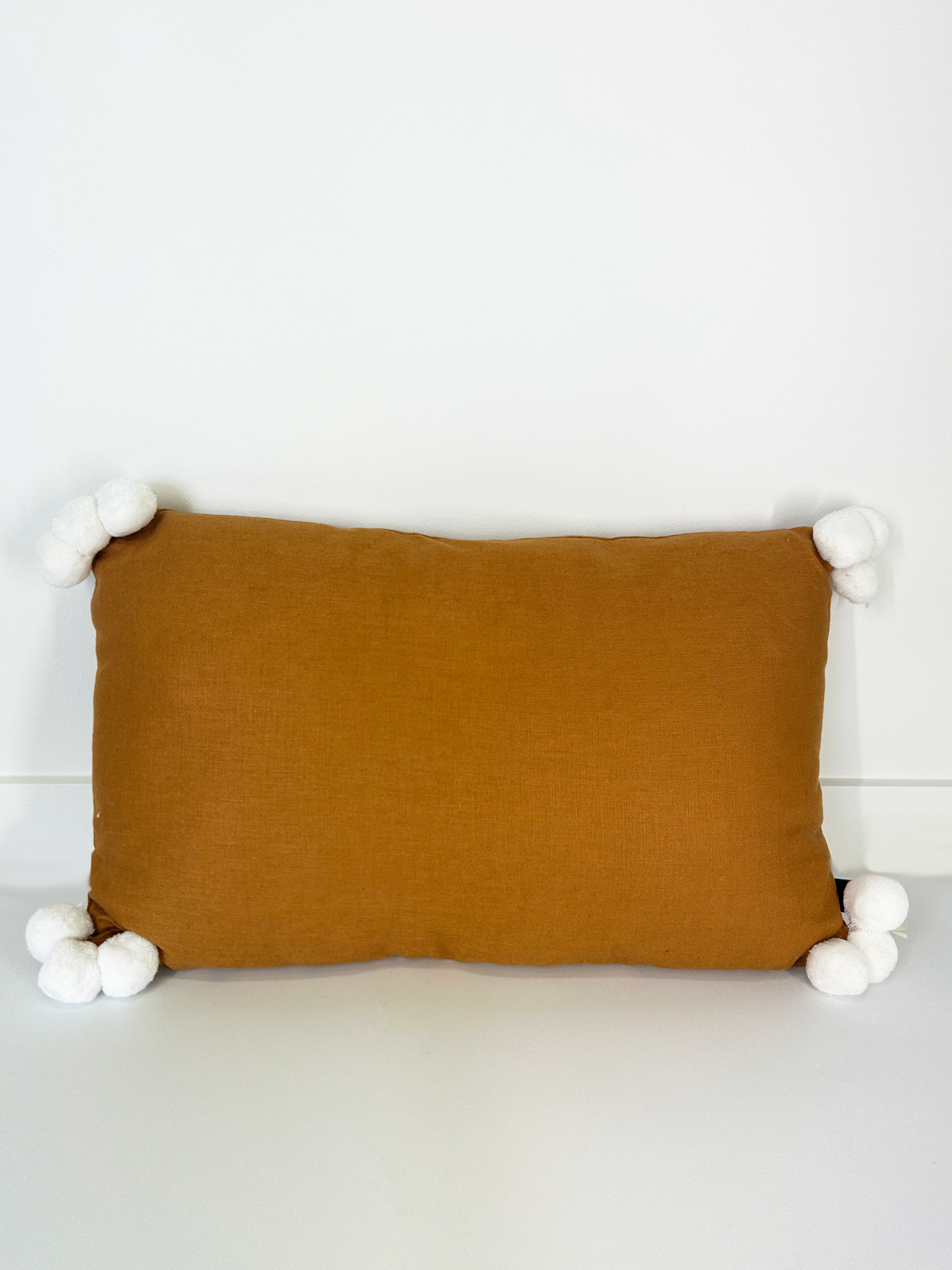 Rust and White Rectangle Throw Cushion with Pom Poms