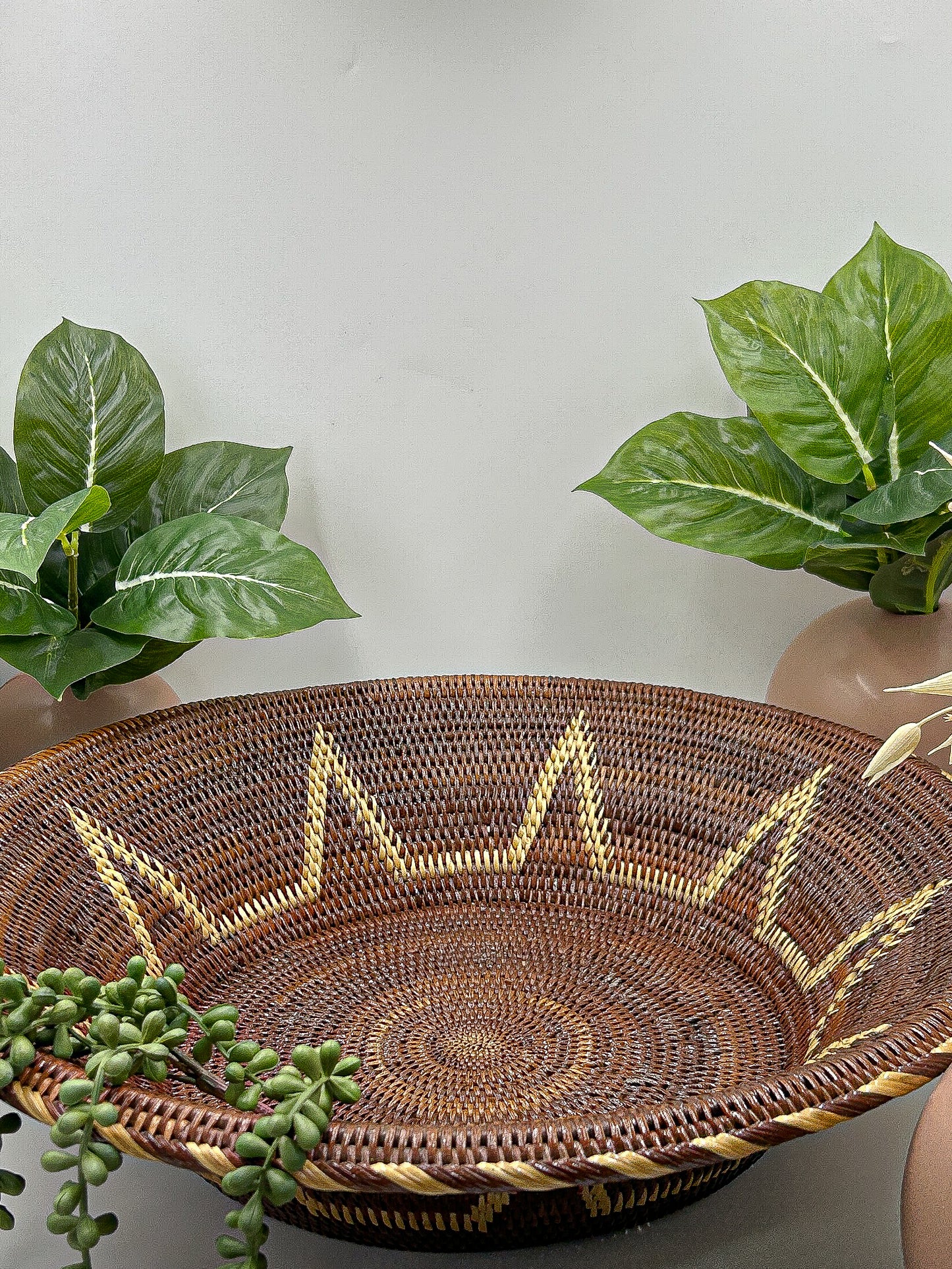 Brown & Cream Round Handwoven Basket from Papua New Guinea without handles with star detailing.