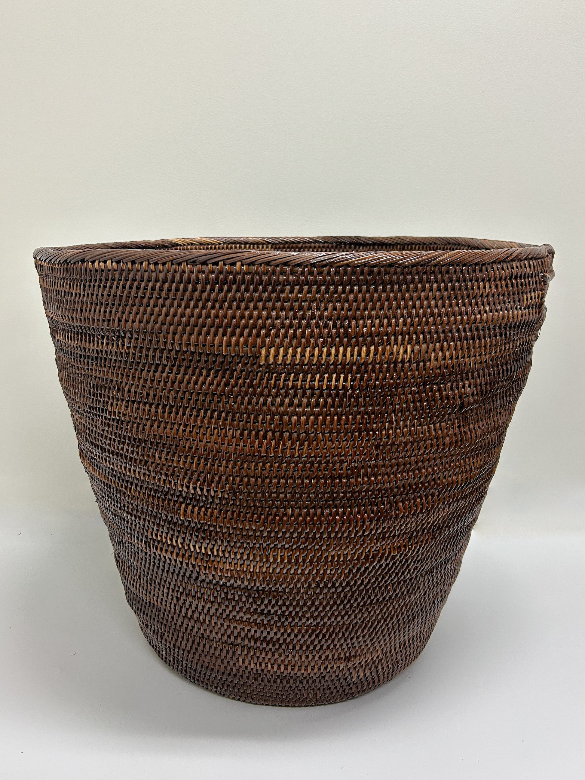 Extra Large Dark Brown Woven Laundry Basket with cutout handles handmade handwoven in papua new guinea