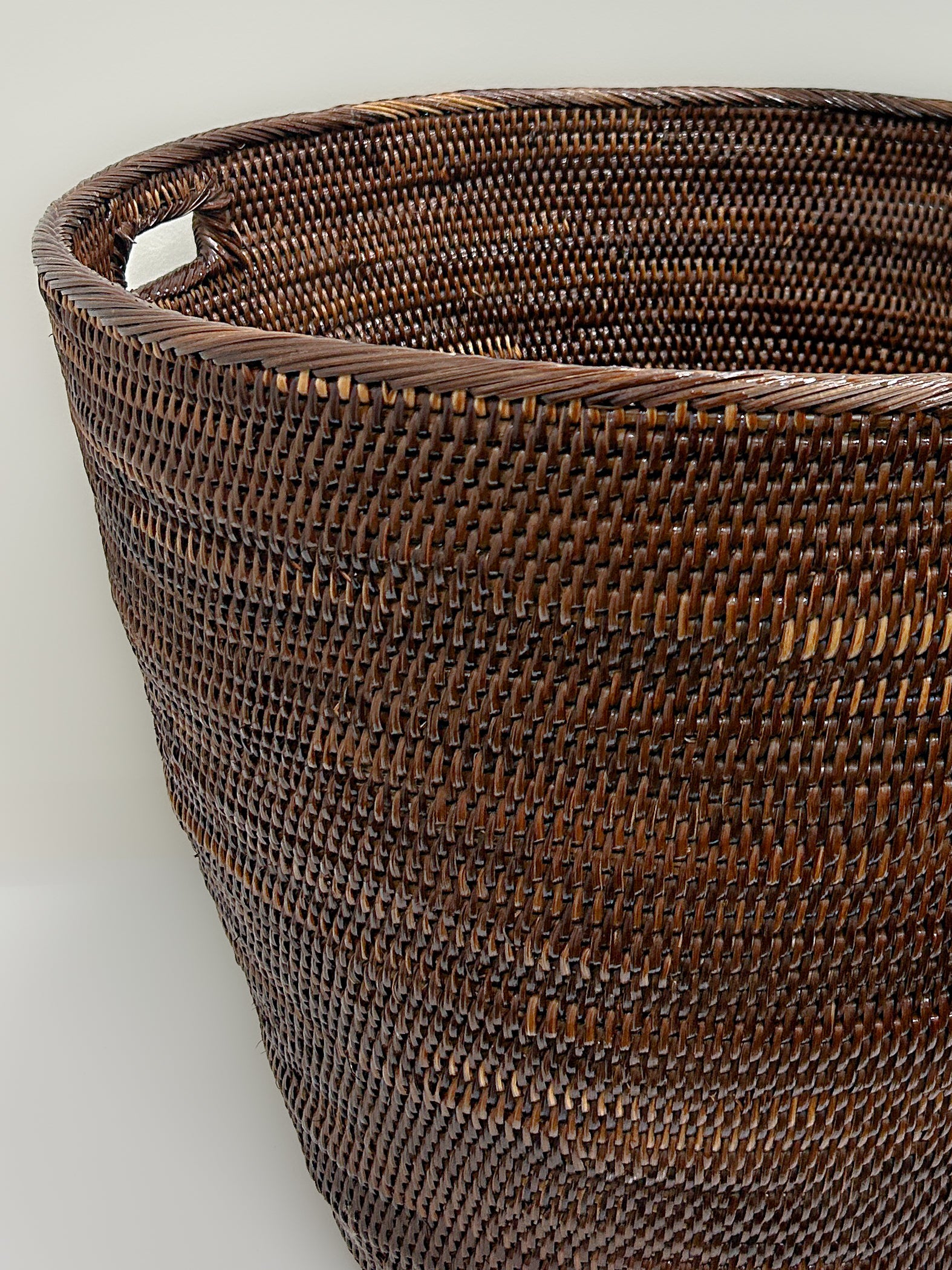 Extra Large Dark Brown Woven Laundry Basket with cutout handles handmade handwoven in papua new guinea