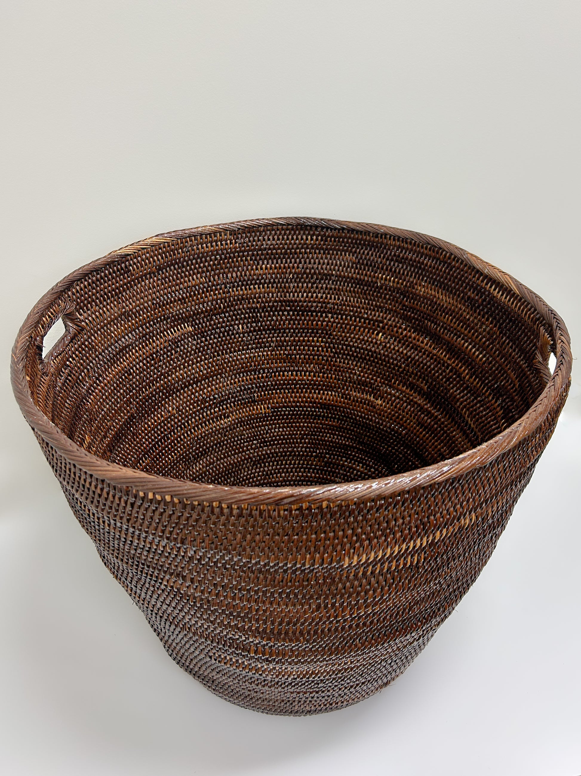 Extra Large Dark Brown Woven Laundry Basket with cutout handles handmade handwoven in papua new guinea