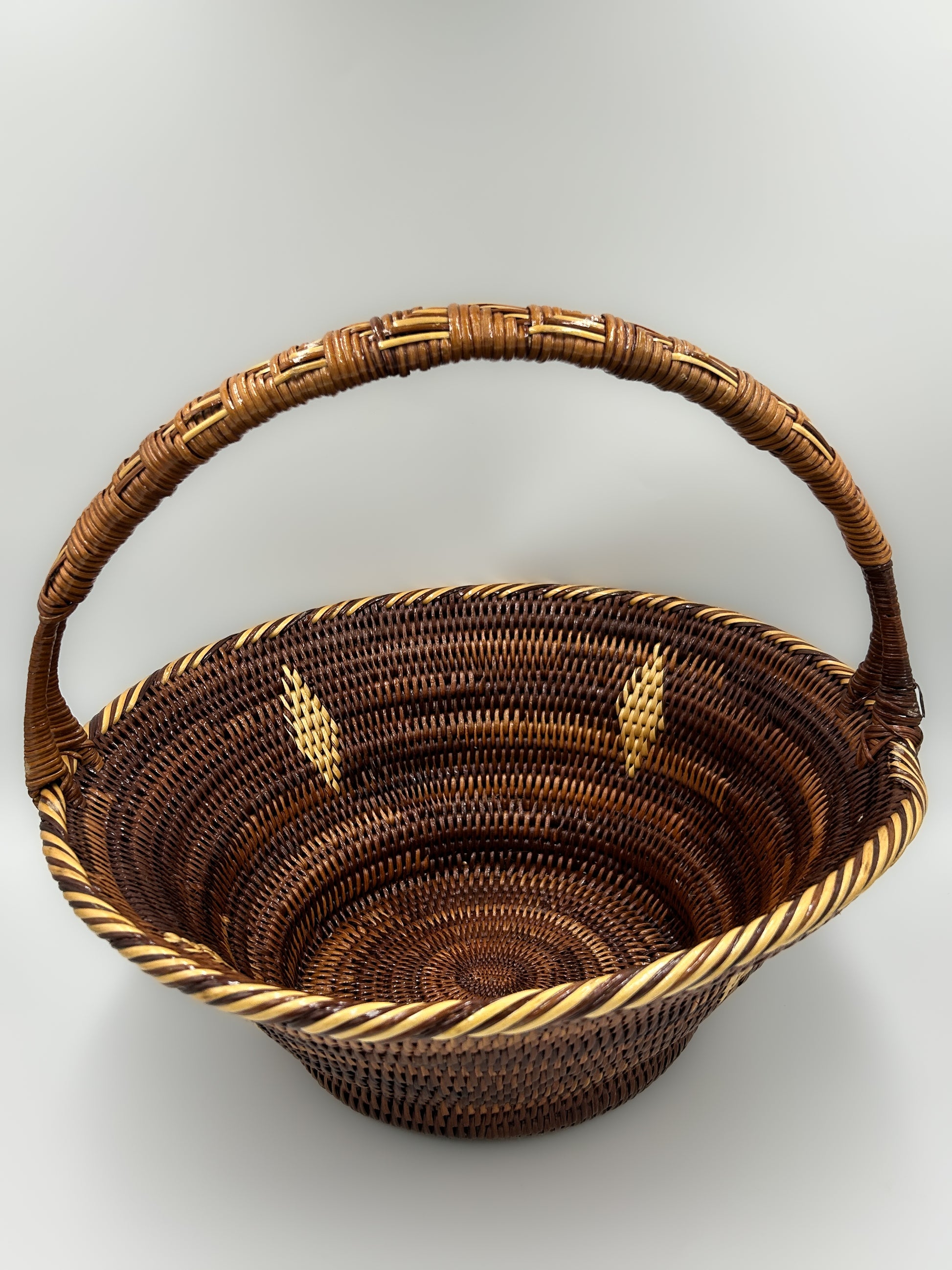 Round Handwoven Basket  from Papua New Guinea with handle and diamon and stripe detailing