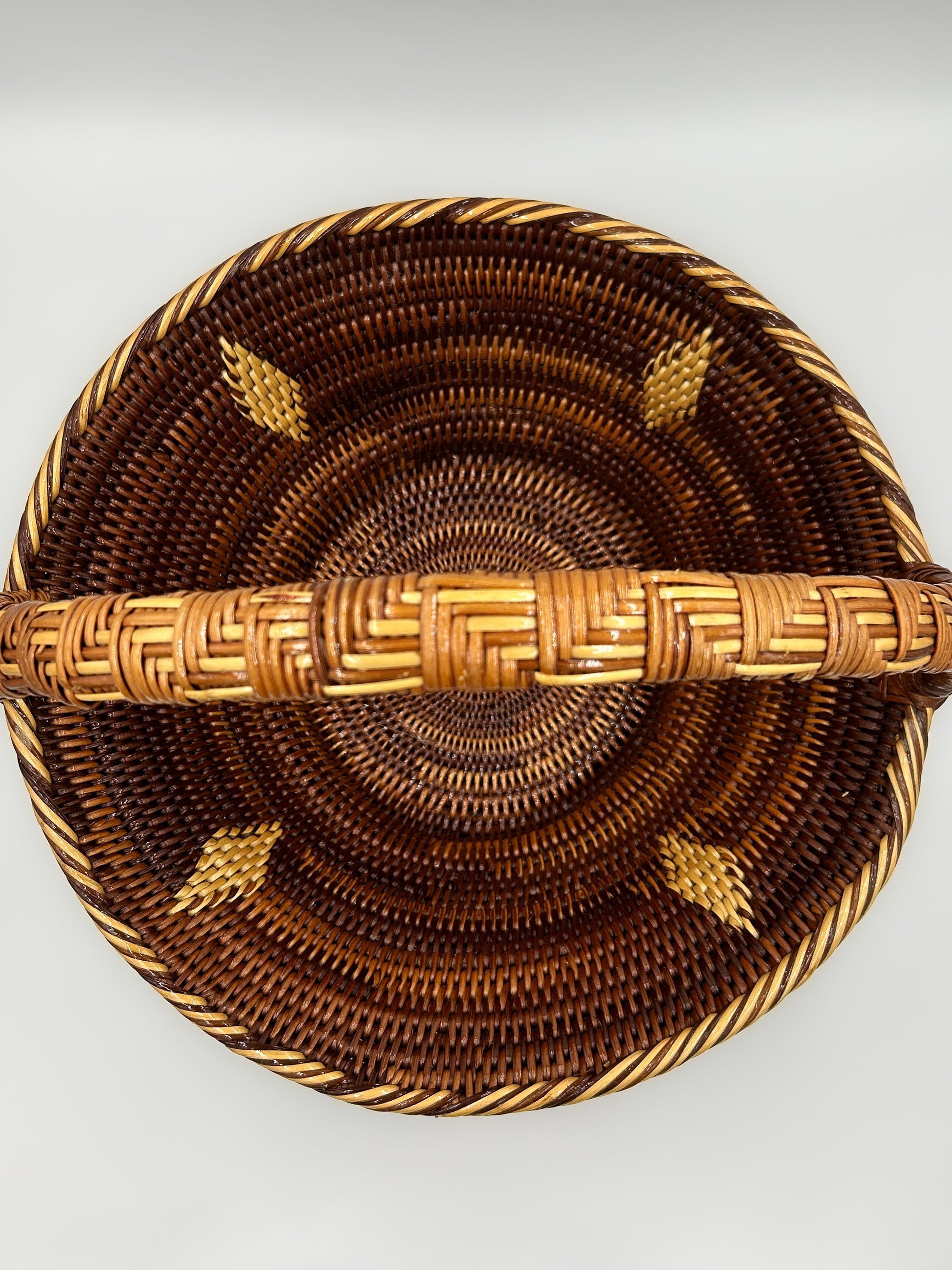 Round Handwoven Basket  from Papua New Guinea with handle and diamon and stripe detailing