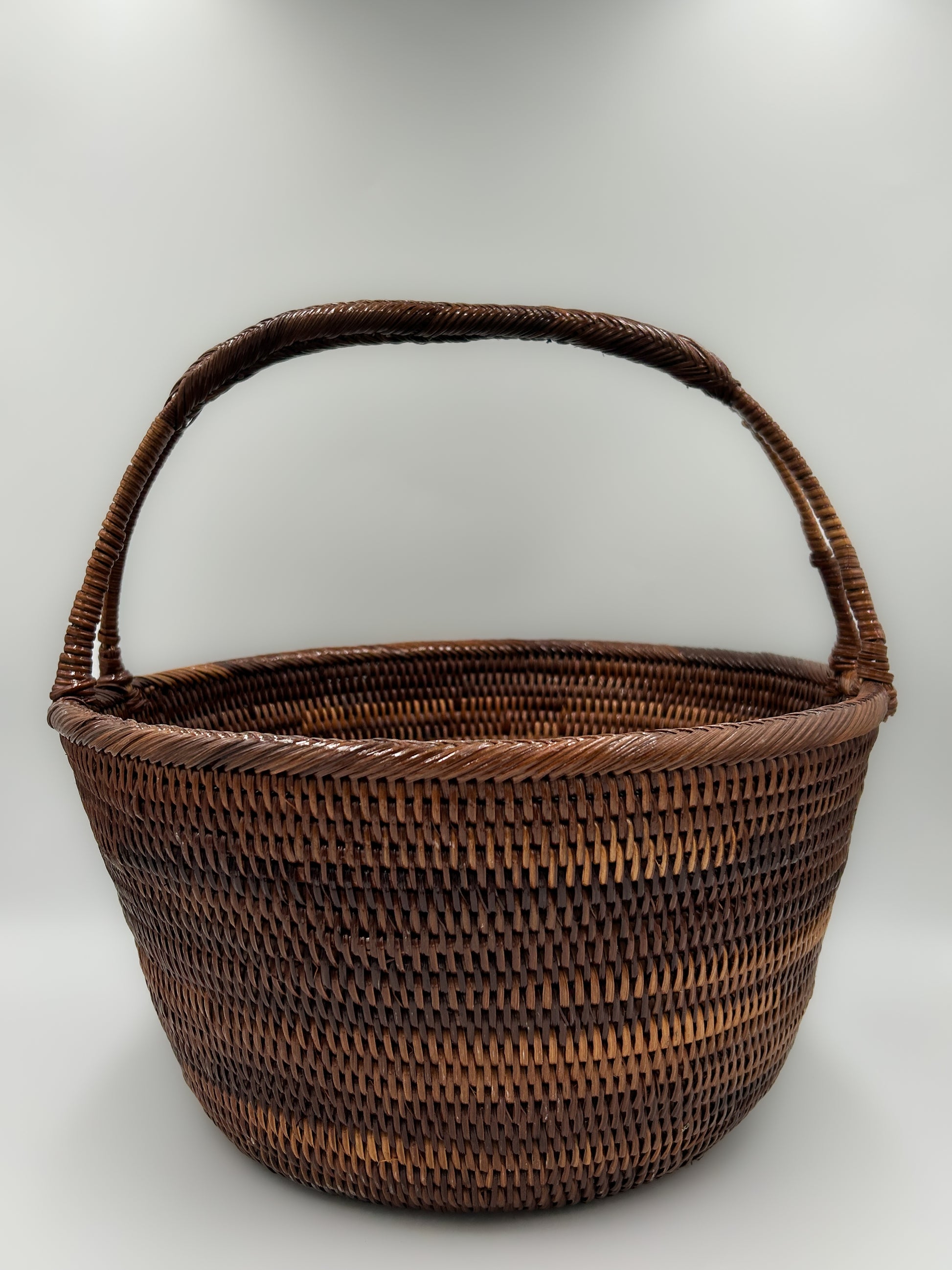 Basic Dark Brown Woven Basket with Handle. Handwoven in Papua New Guinea.