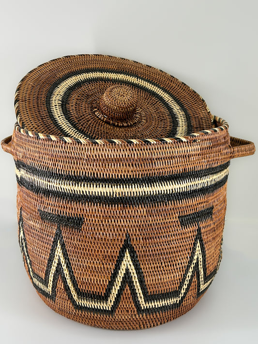 Large Brown Handwoven Basket with cream and black detailing and a matching Lid. Made in Papua New Guinea.